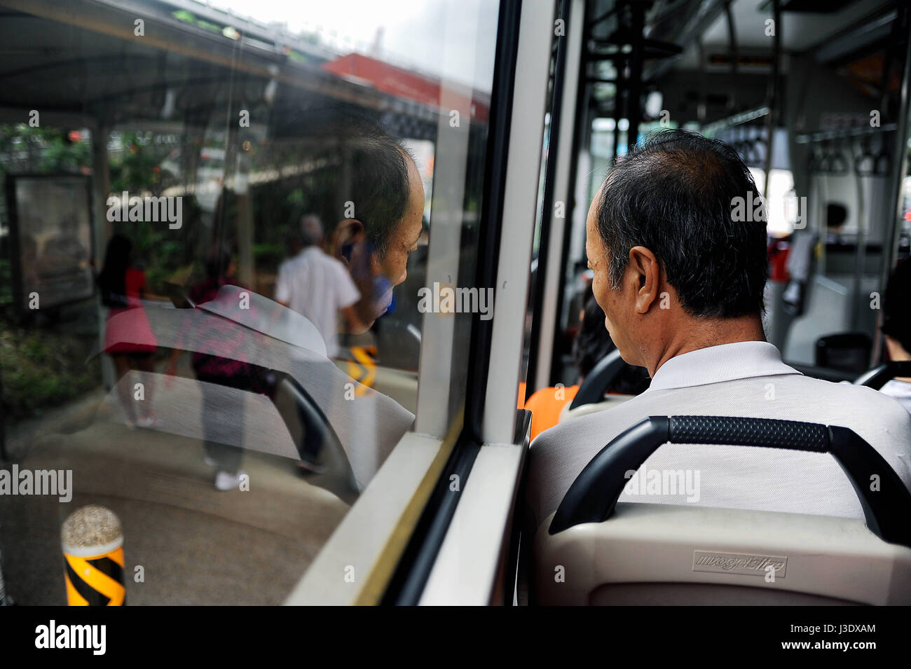 Singapore, Republic of Singapore, Asia, A man rides on a bus Stock ...