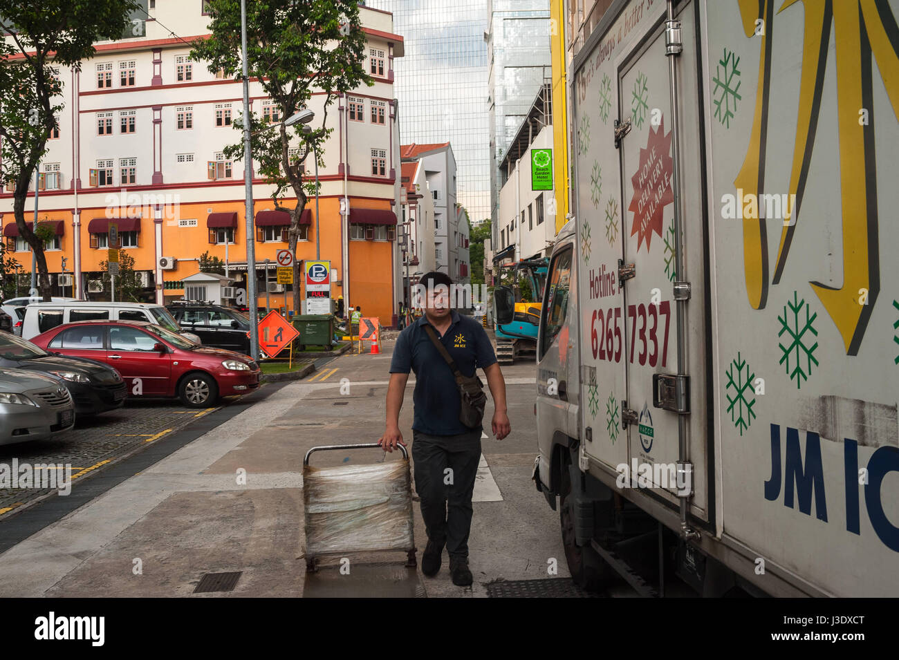 Singapore, Republic of Singapore, Asia, A man walks towards his lorry Stock Photo