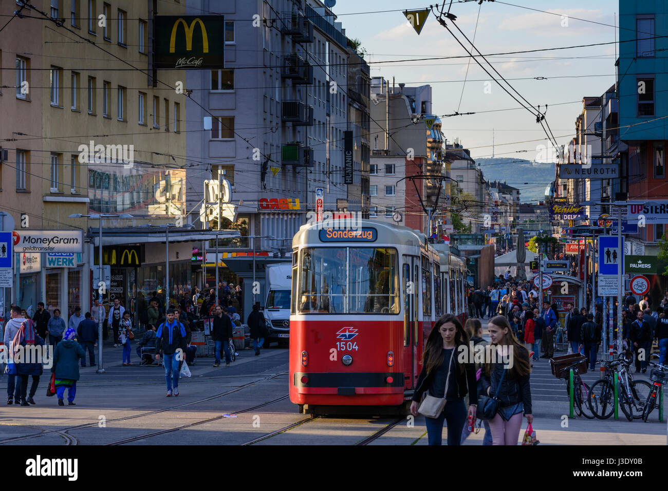 street Favoritenstraße, streetcar, people, view to Kahlenberg, Wien, Vienna, 10. Favoriten, Wien, Austria Stock Photo
