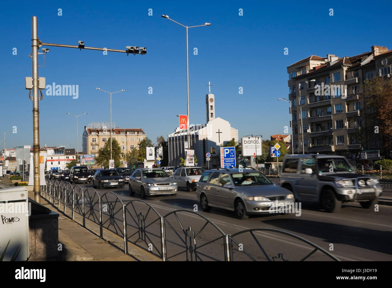 Rush hour traffic on a busy boulevard in Sofia being monitored by surveillance cameras, Bulgaria, Eastern Europe. Stock Photo