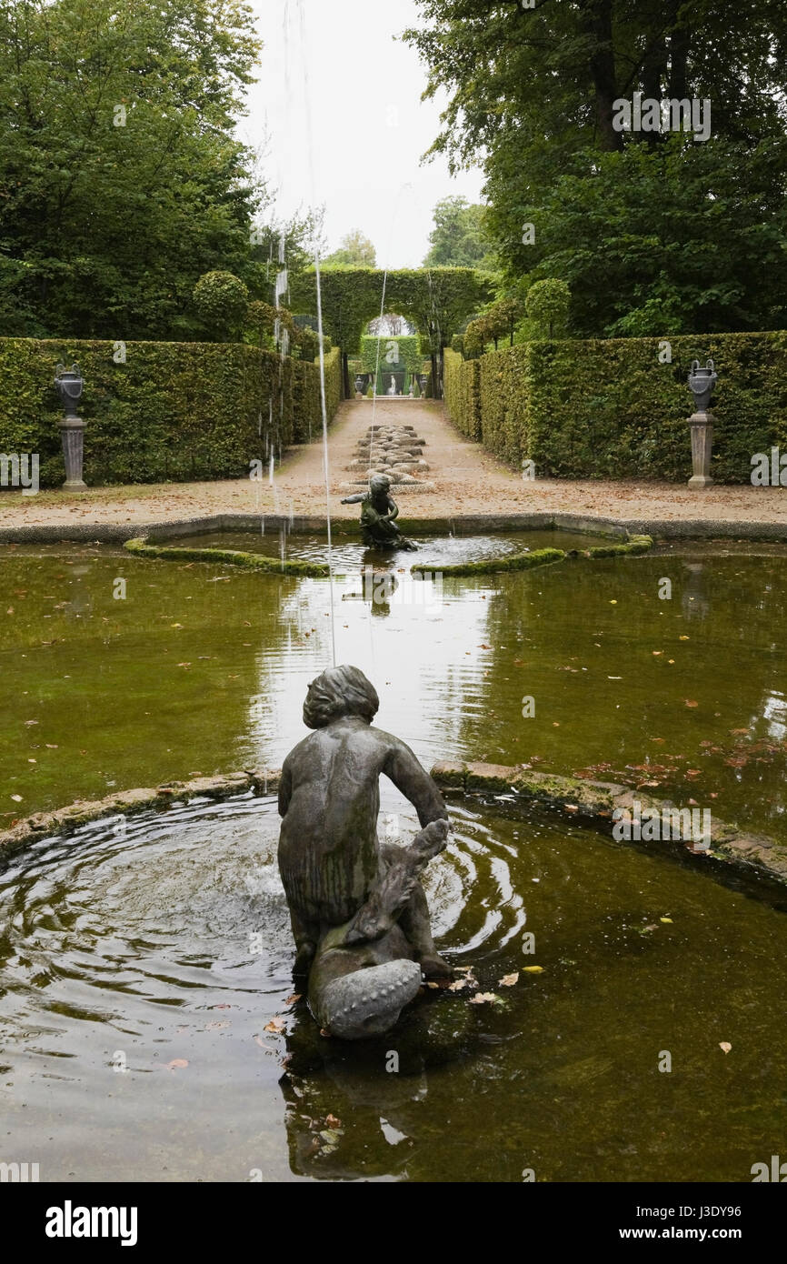 Sculptures in the water fountain pool in the formal garden at the Schwetzingen palace in late summer, Schwetzingen, Germany, Europe. Stock Photo
