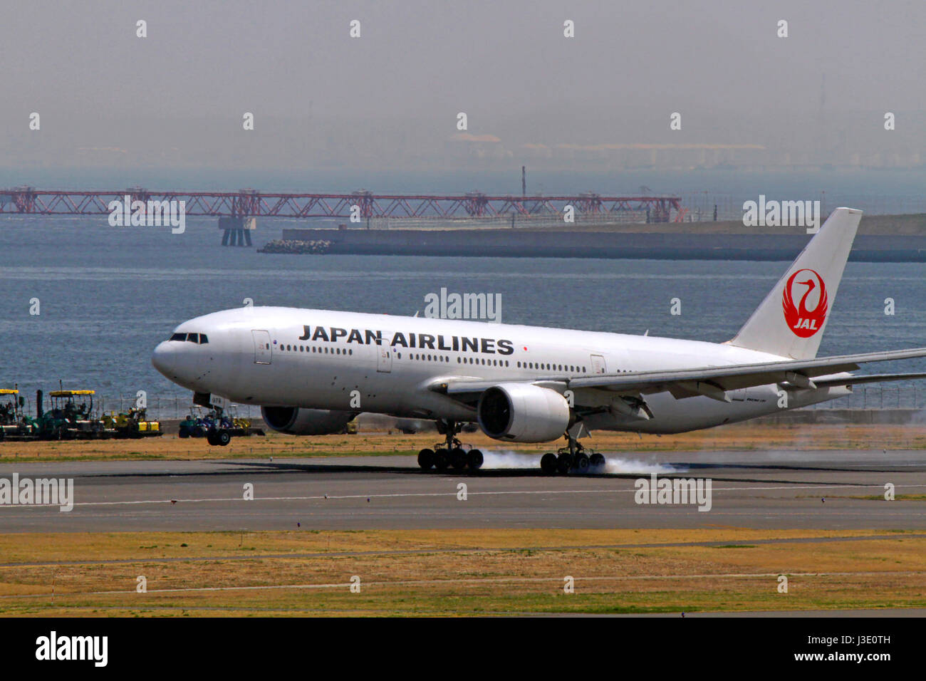 JAL Boeing 777 Landing at Haneda Airport Tokyo Japan Stock Photo