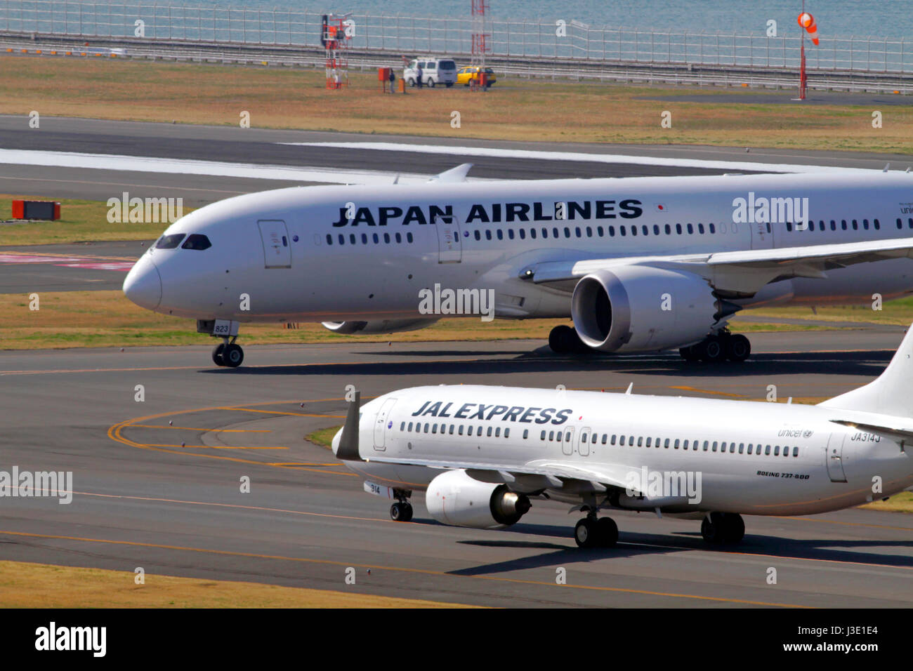 Jal Express Boeing 737 And Jal 787 Farther Taxing At Haneda Airport Stock Photo Alamy