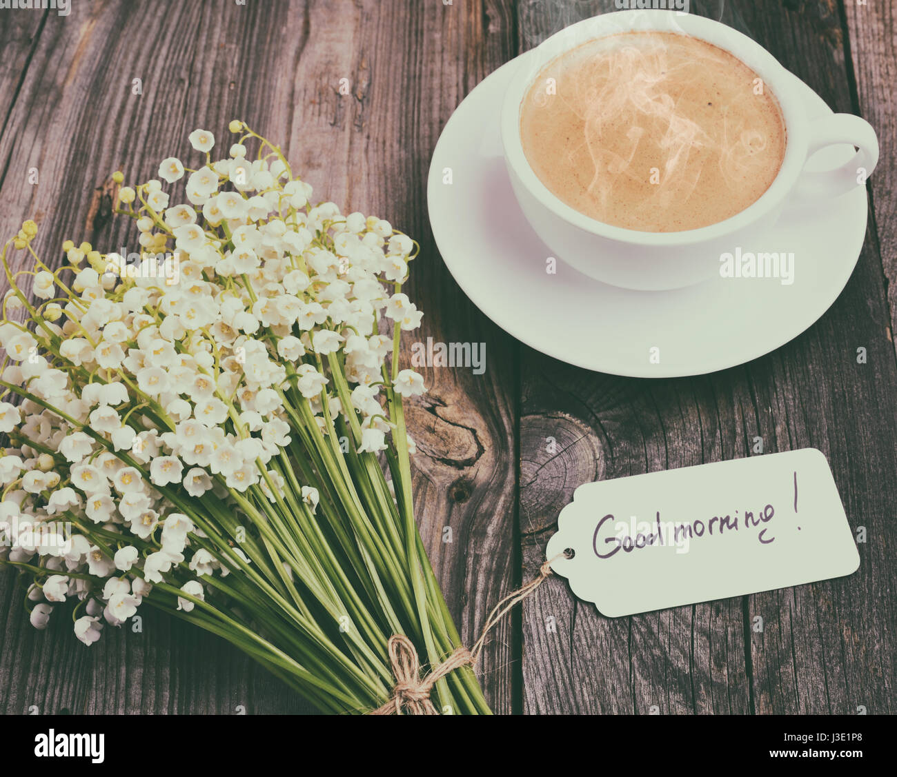 Cup Of Hot Black Coffee And A Bouquet Of Fresh Lilies Of The