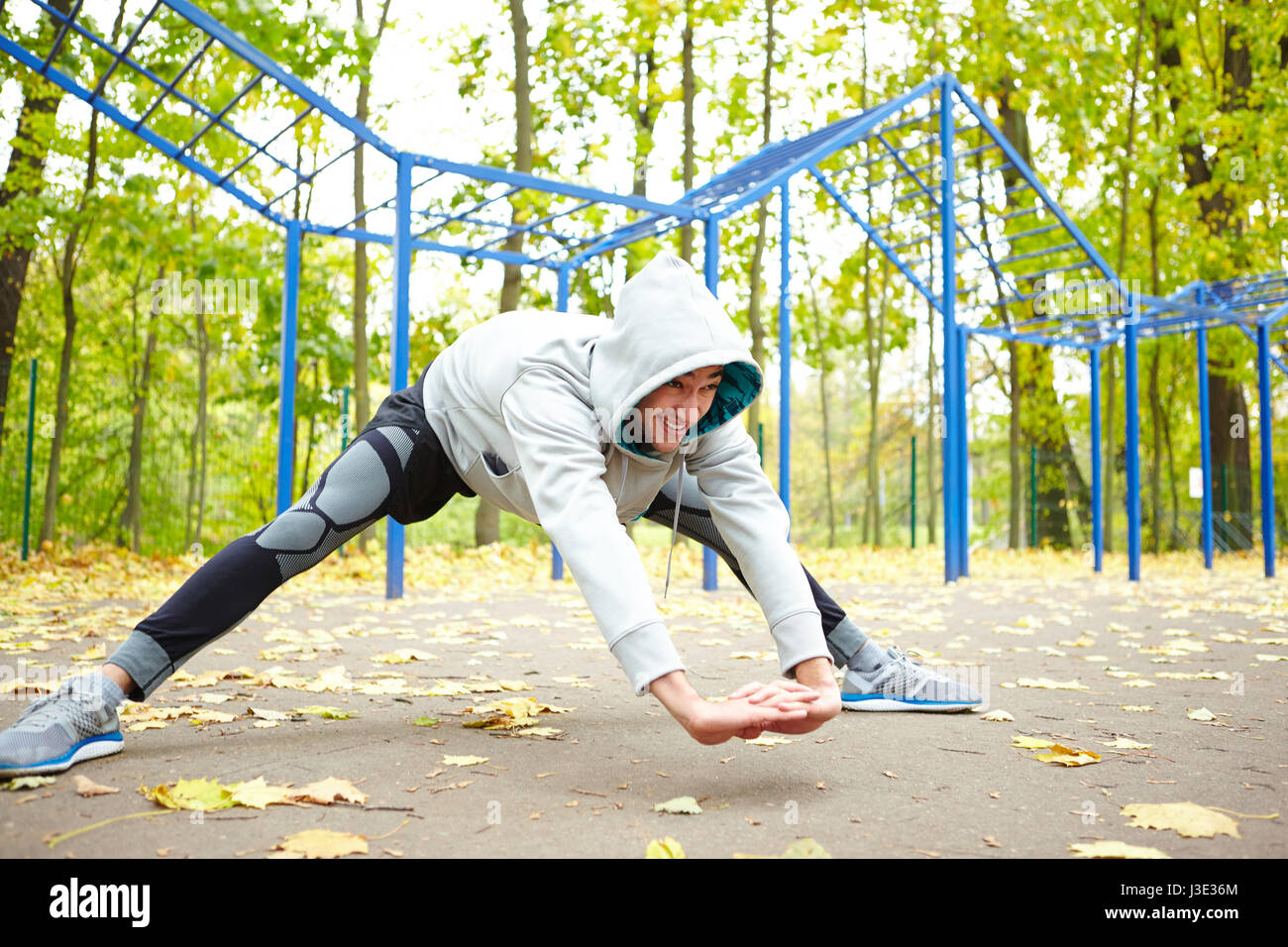 Active man doing stretching hi-res stock photography and images - Alamy