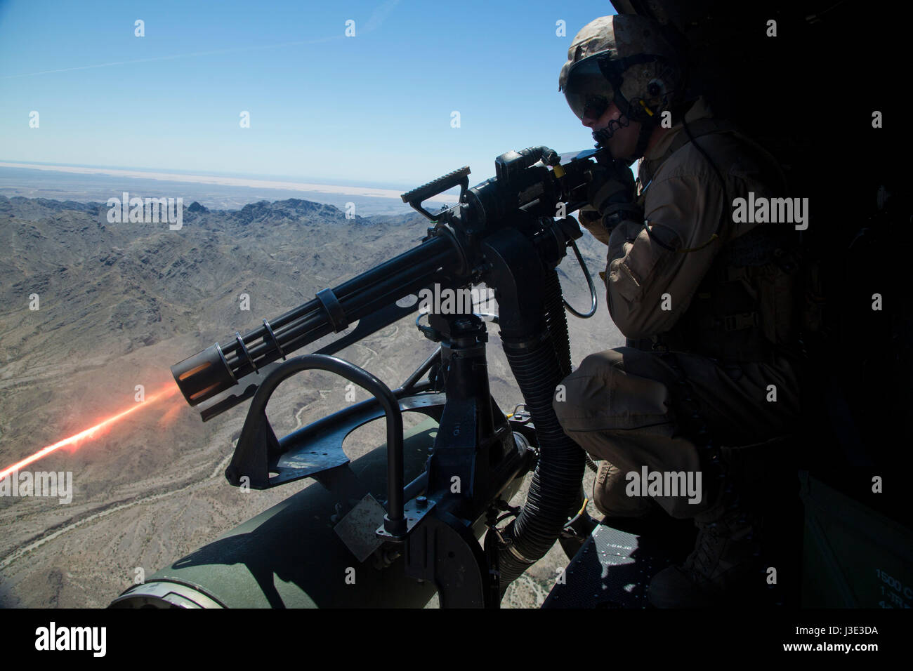 U.S. Marine soldiers operate a GAU-17 Vulcan Gatling machine gun cannon from a USMC UH-1Y Venom helicopter during an aerial gunnery drill at the Chocolate Mountain Aerial Gunnery Range April 5, 2017 in Niland, California.    (photo by Aaron James B. Vinculado /US Marines via Planetpix) Stock Photo