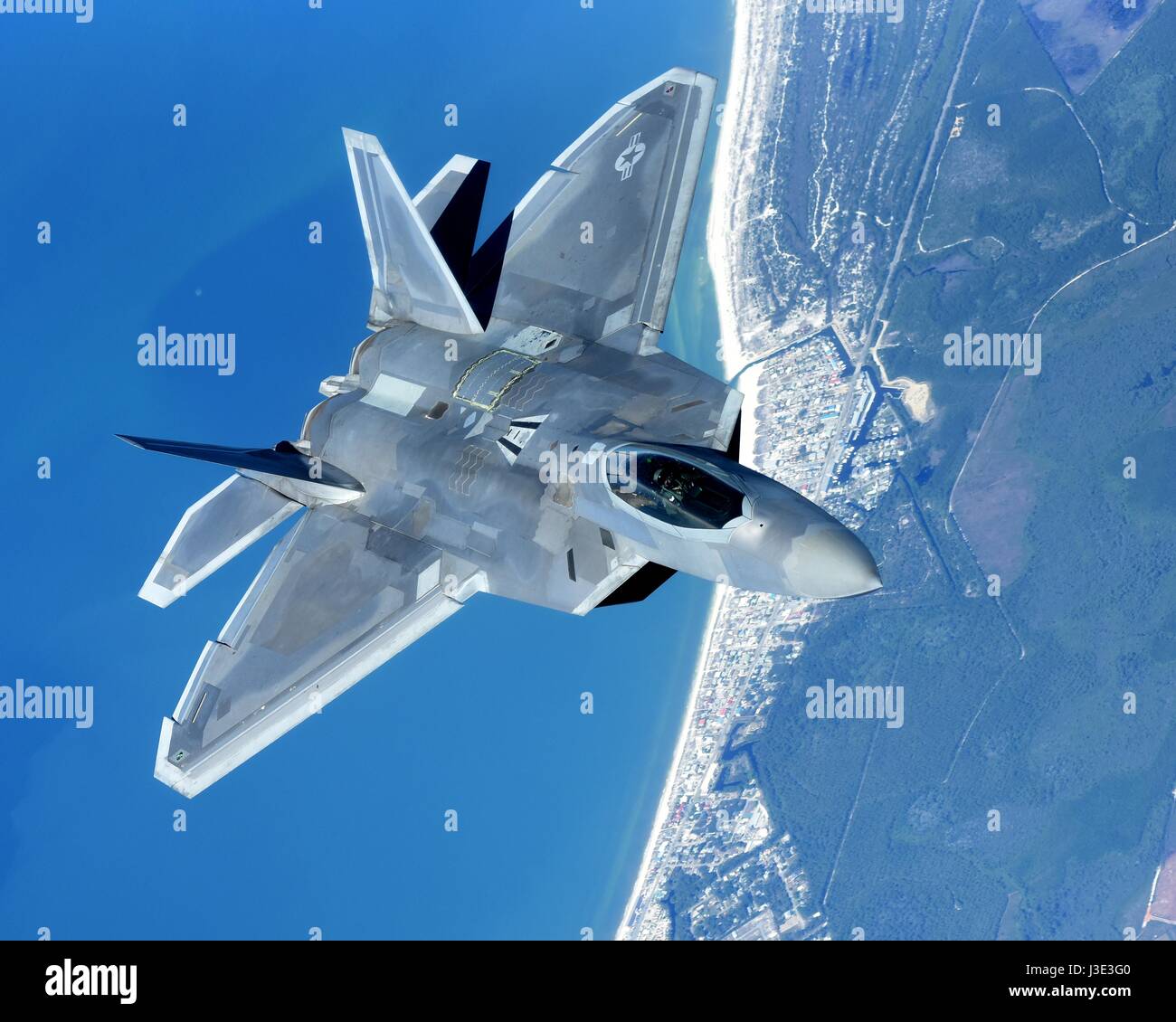 A USAF F-22 Raptor stealth tactical fighter aircraft flies over the Gulf of Mexico April 1, 2017 near Panama City, Florida.    (photo by Cody R. Miller/US Air Force  via Planetpix) Stock Photo