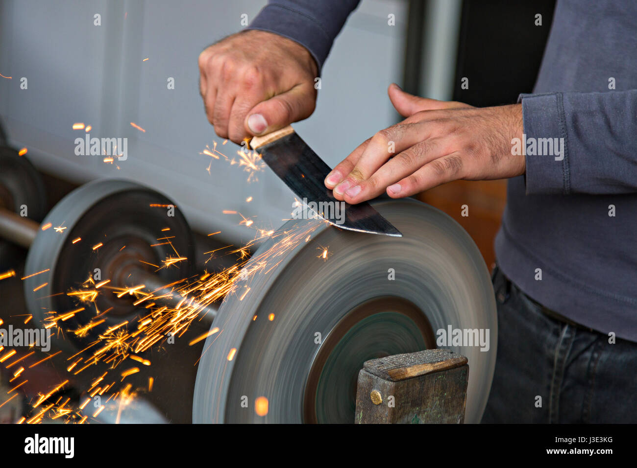 Sharpening the knife Stock Photo Alamy