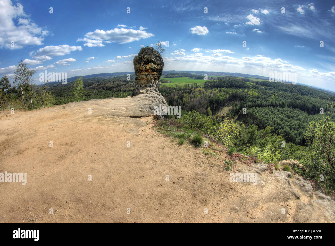 Capska cudgel - rock formation on a rocky promontory is a massive rock cudgel from iron sandstone that rises at the edge of a steep cliff Stock Photo