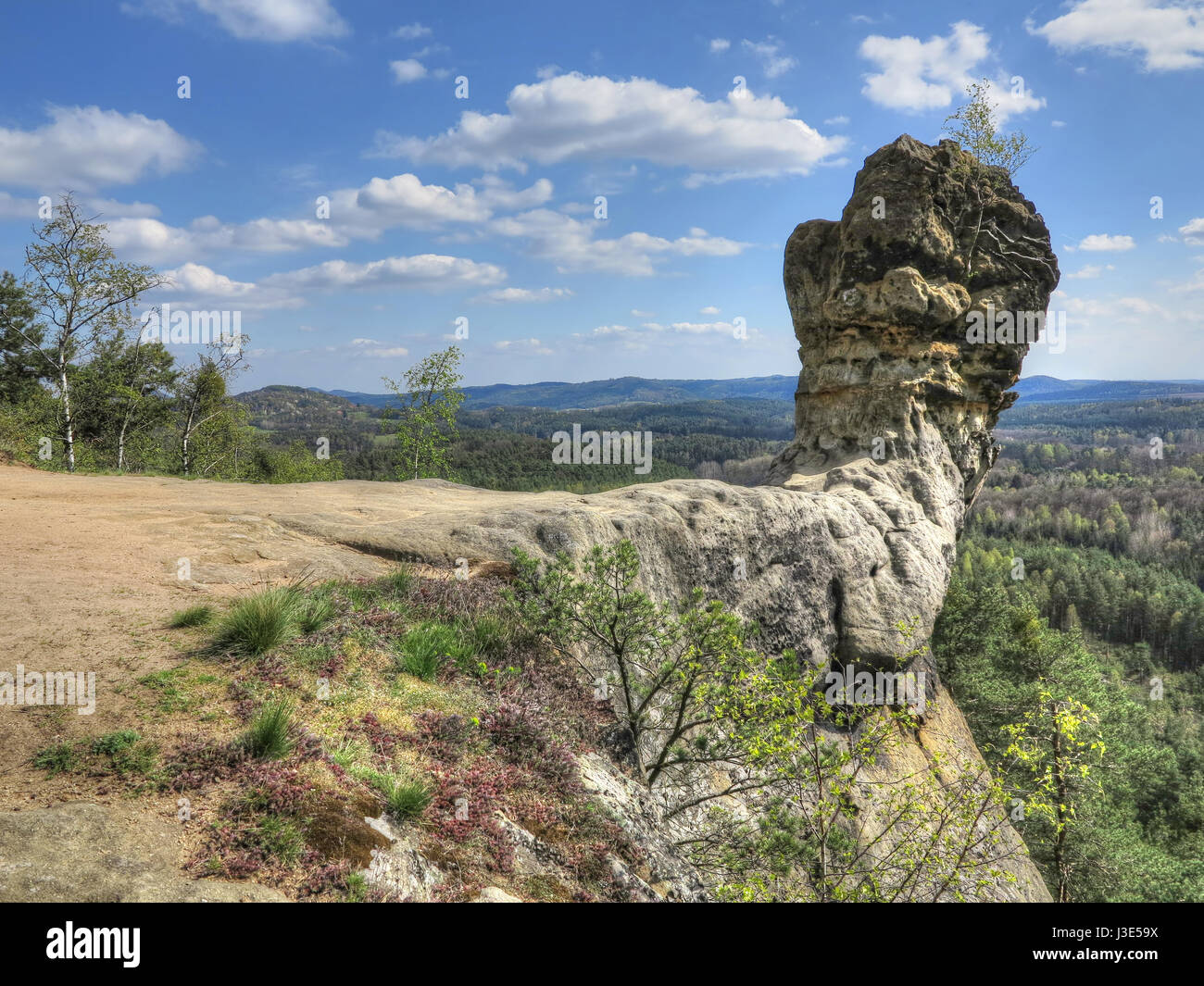 Capska cudgel - rock formation on a rocky promontory is a massive rock cudgel from iron sandstone that rises at the edge of a steep cliff Stock Photo