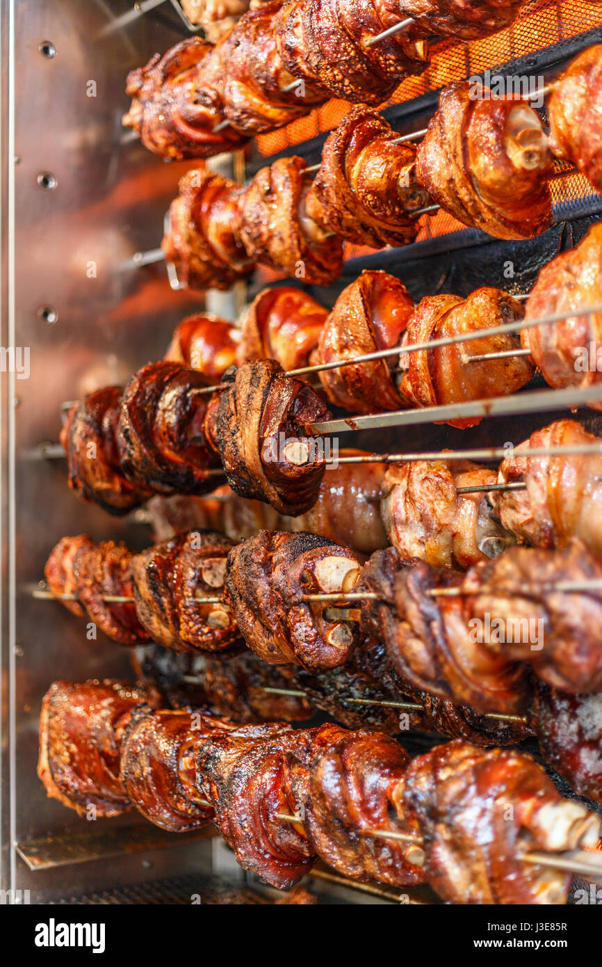 Roasted pork knuckles on the spit Stock Photo Alamy