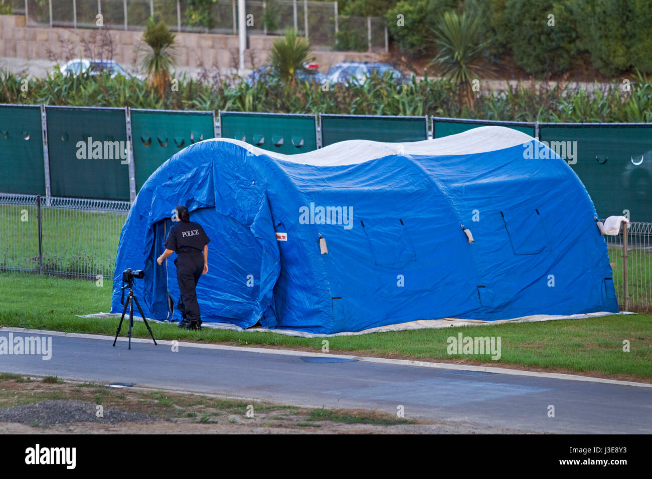 Crime Scene with Police photographer, cordon and tent, Kingsland, Auckland, New Zealand Stock Photo