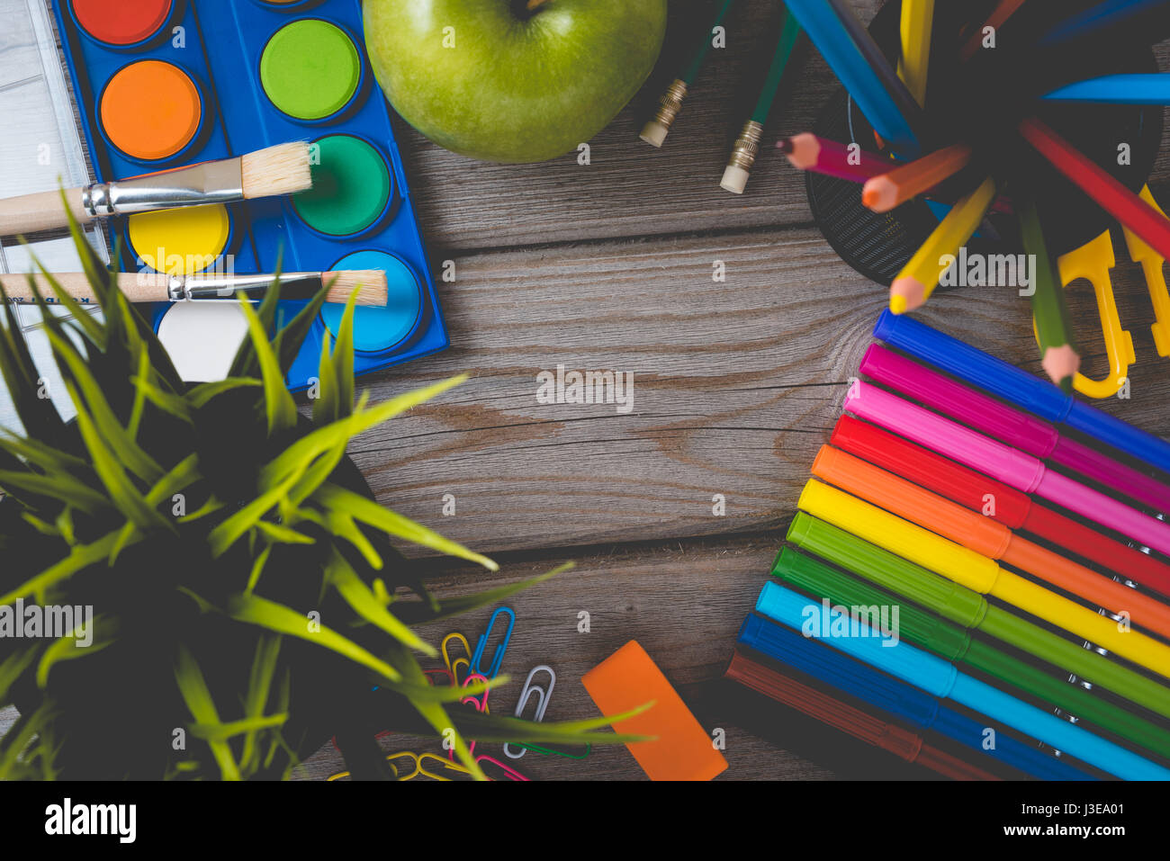 School supplies on wooden table. Close up Stock Photo - Alamy