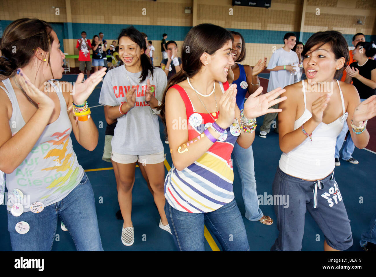 Miami Florida,Homestead,drug free youth club group party,Hispanic girls female,teen teens teenagers students line dance dancing smiling friends Stock Photo