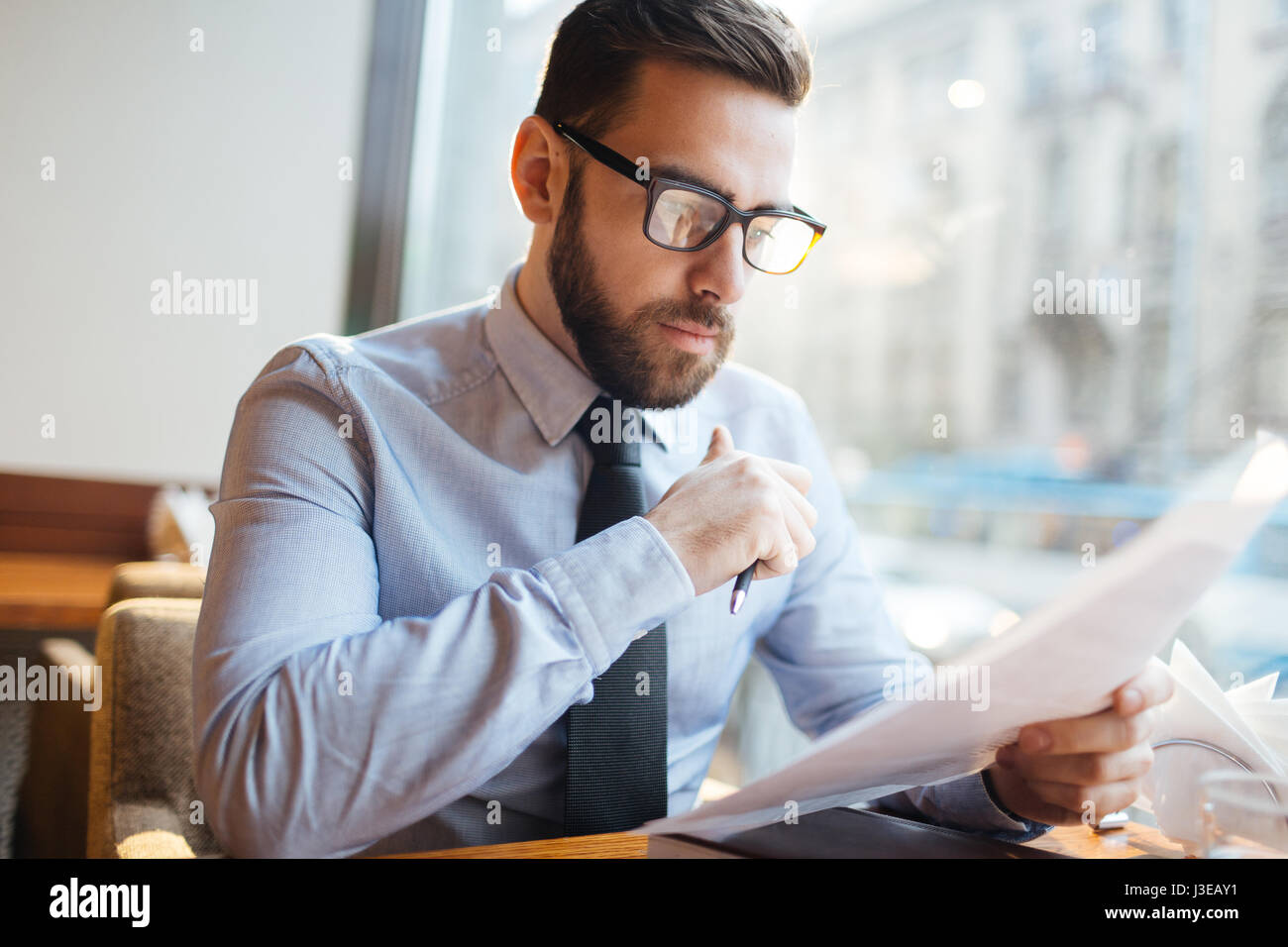 Reading before signing hi-res stock photography and images - Alamy