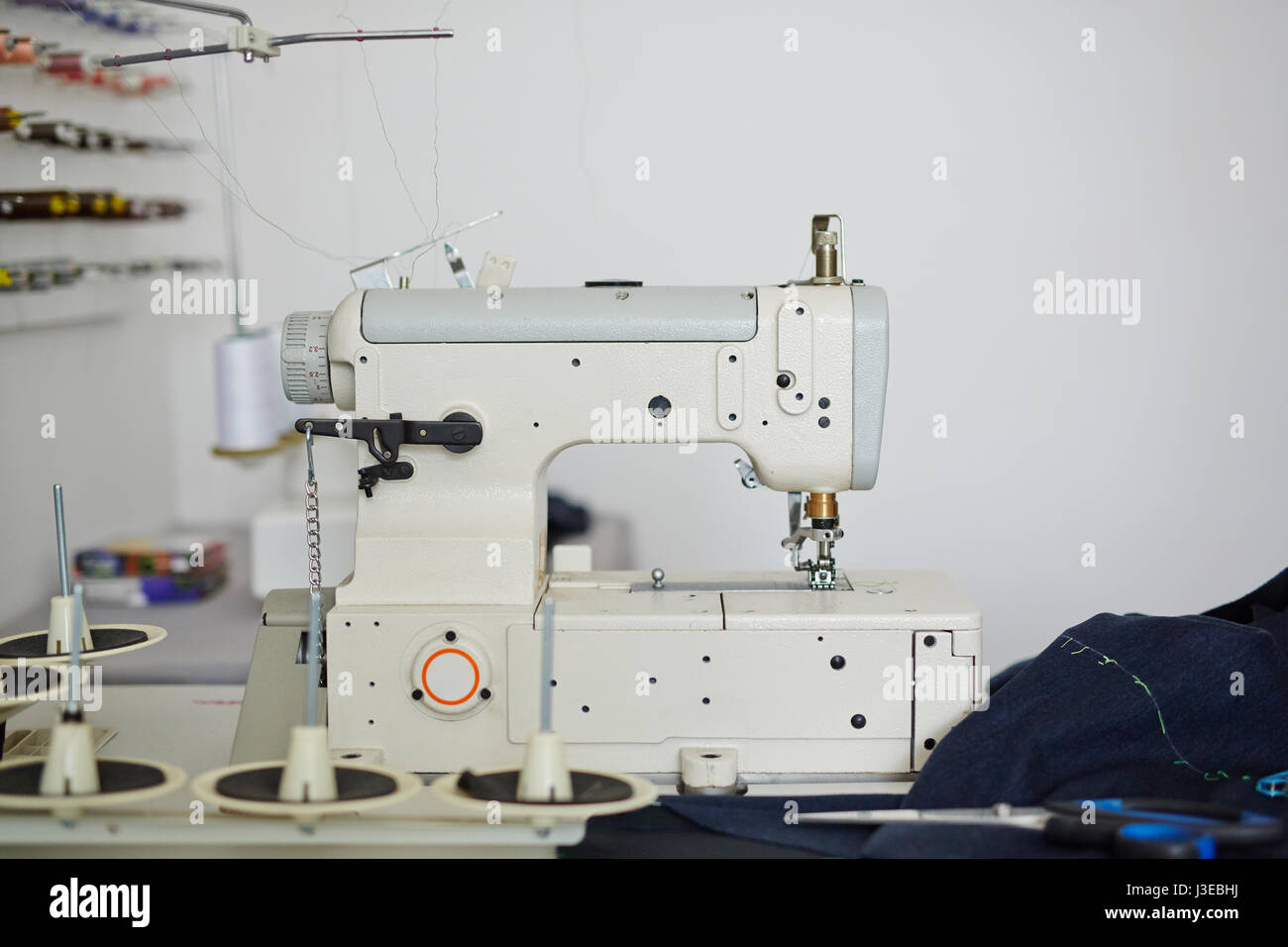 Sewing Machine in Tailoring Studio Stock Photo