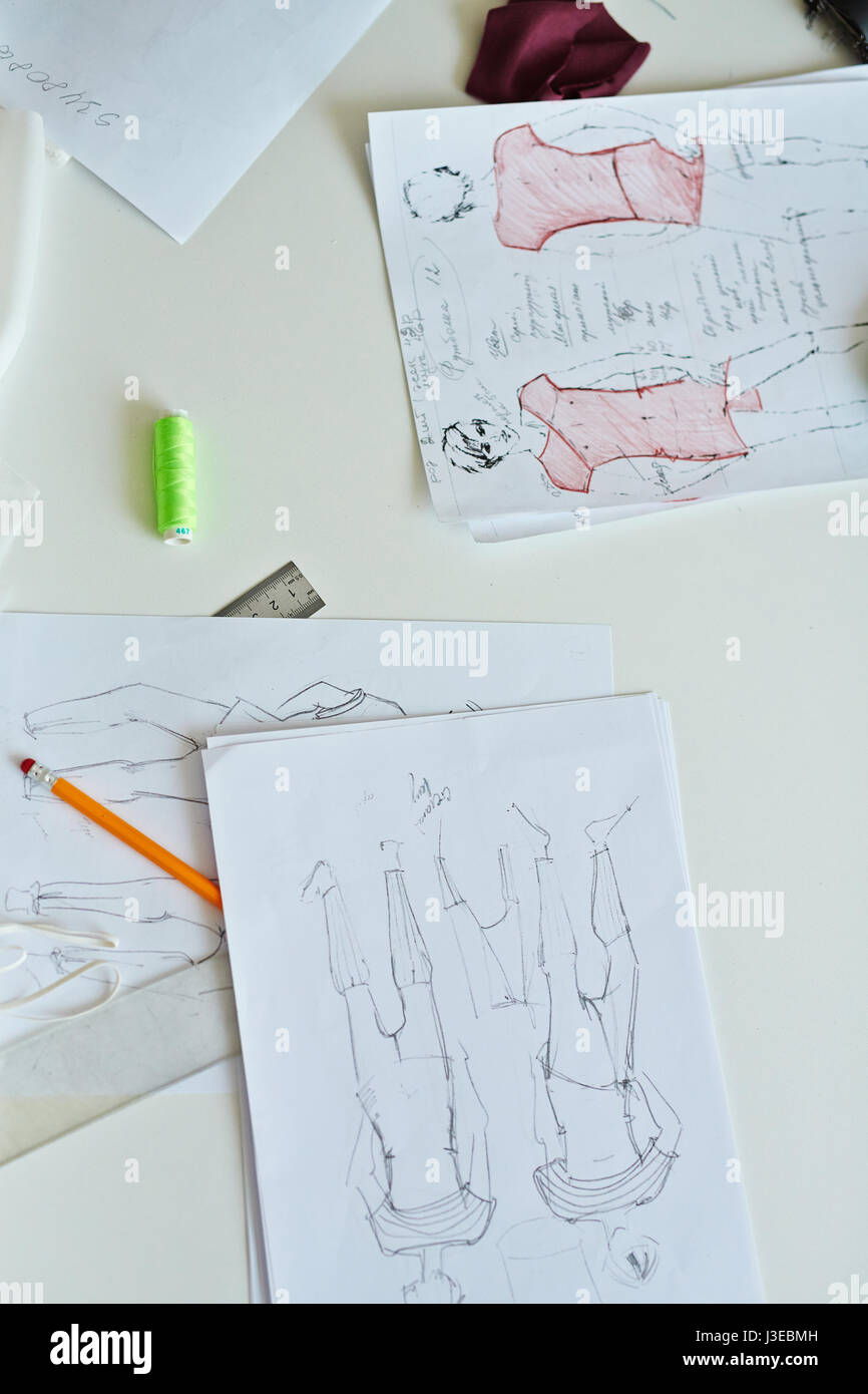 Fashion Designers Sketches on Working Table Stock Photo