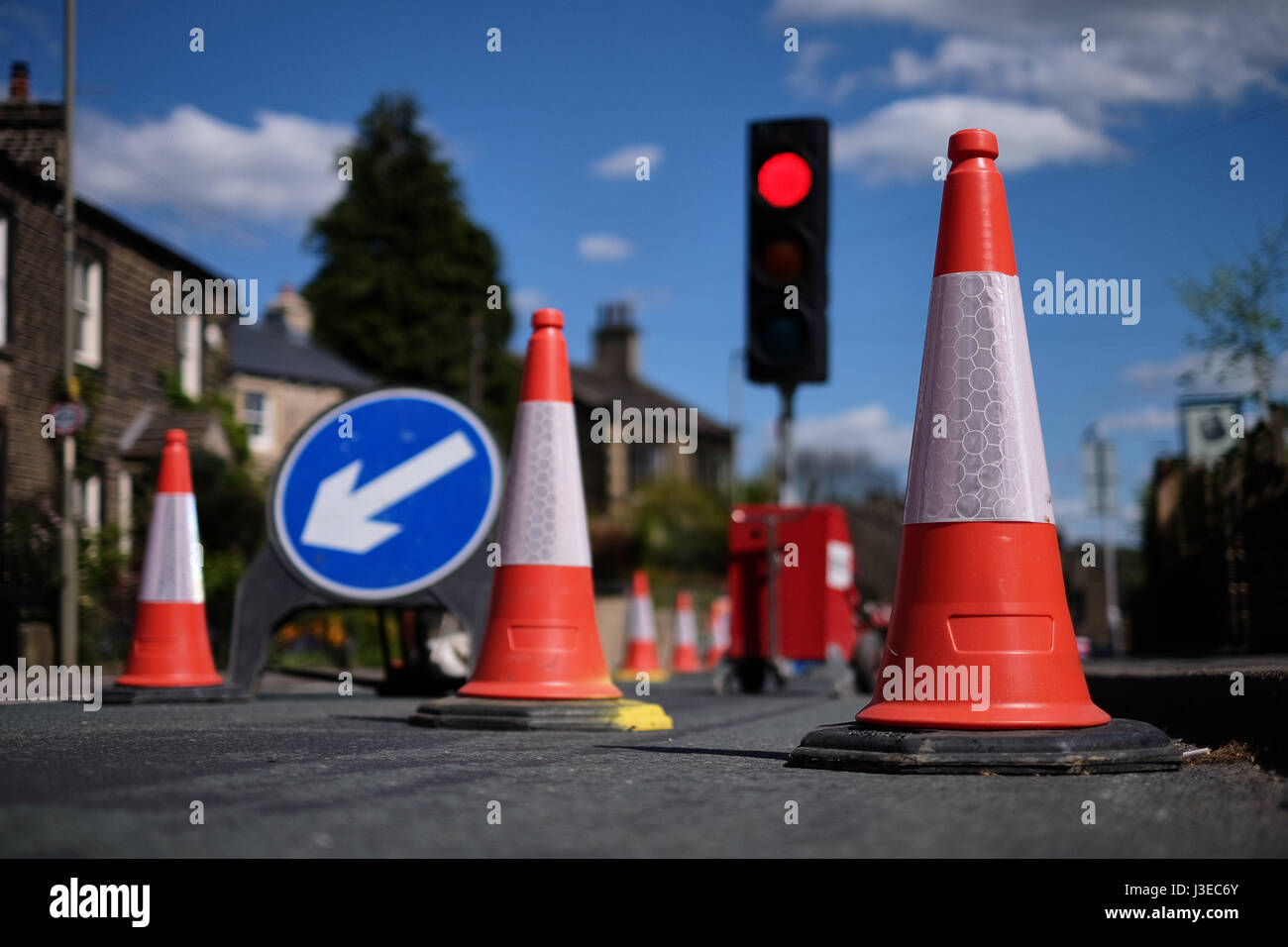 Traffic cones and lights at roadworks Stock Photo