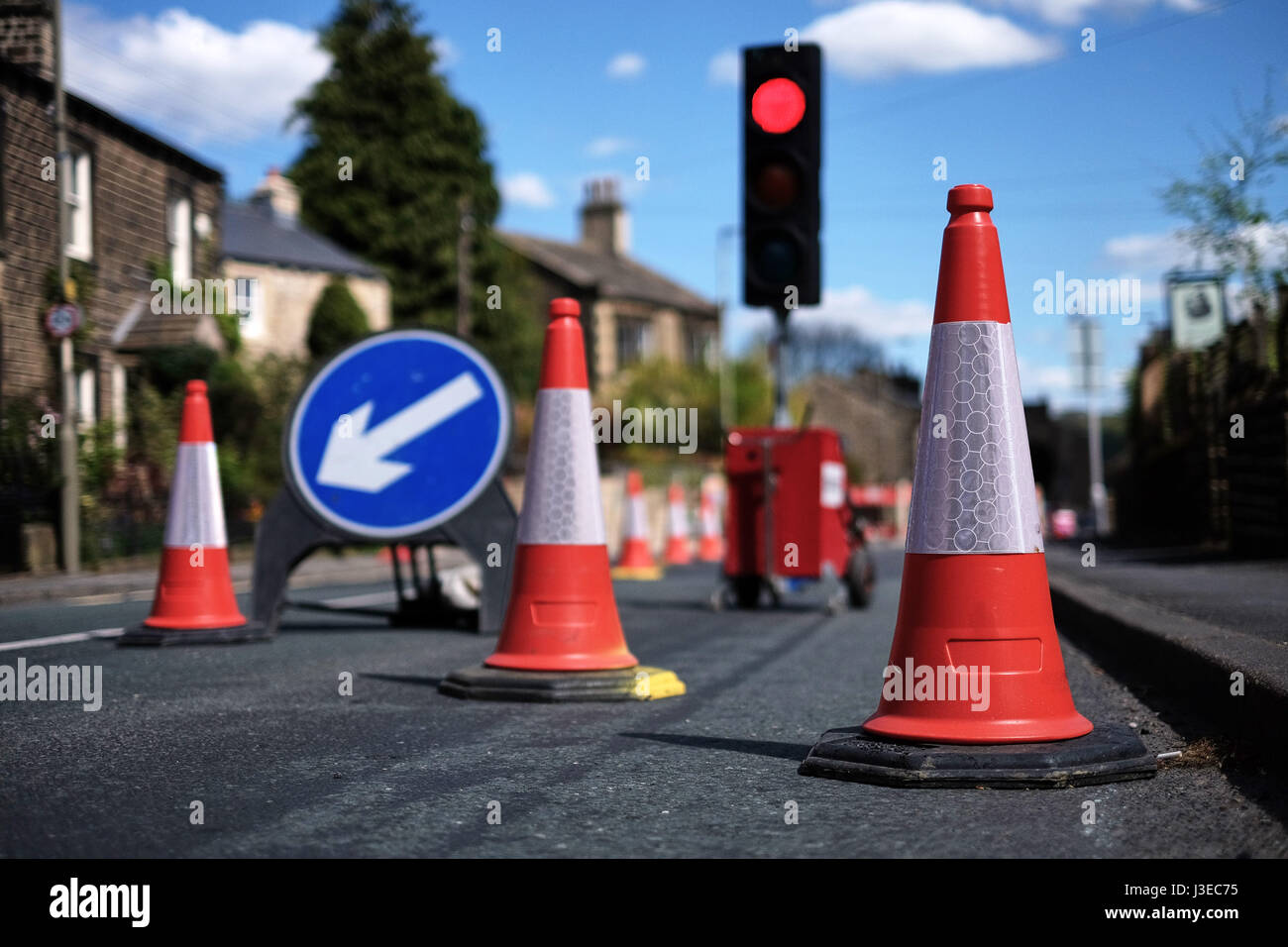 Traffic cones and lights at roadworks Stock Photo