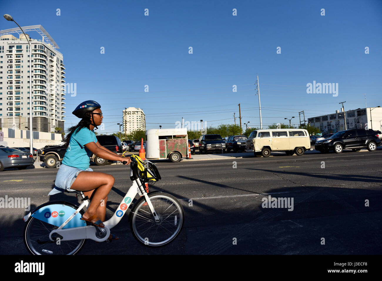 A Lady riding an RTC Bike Share, Bike in downtown Las Vegas Stock Photo