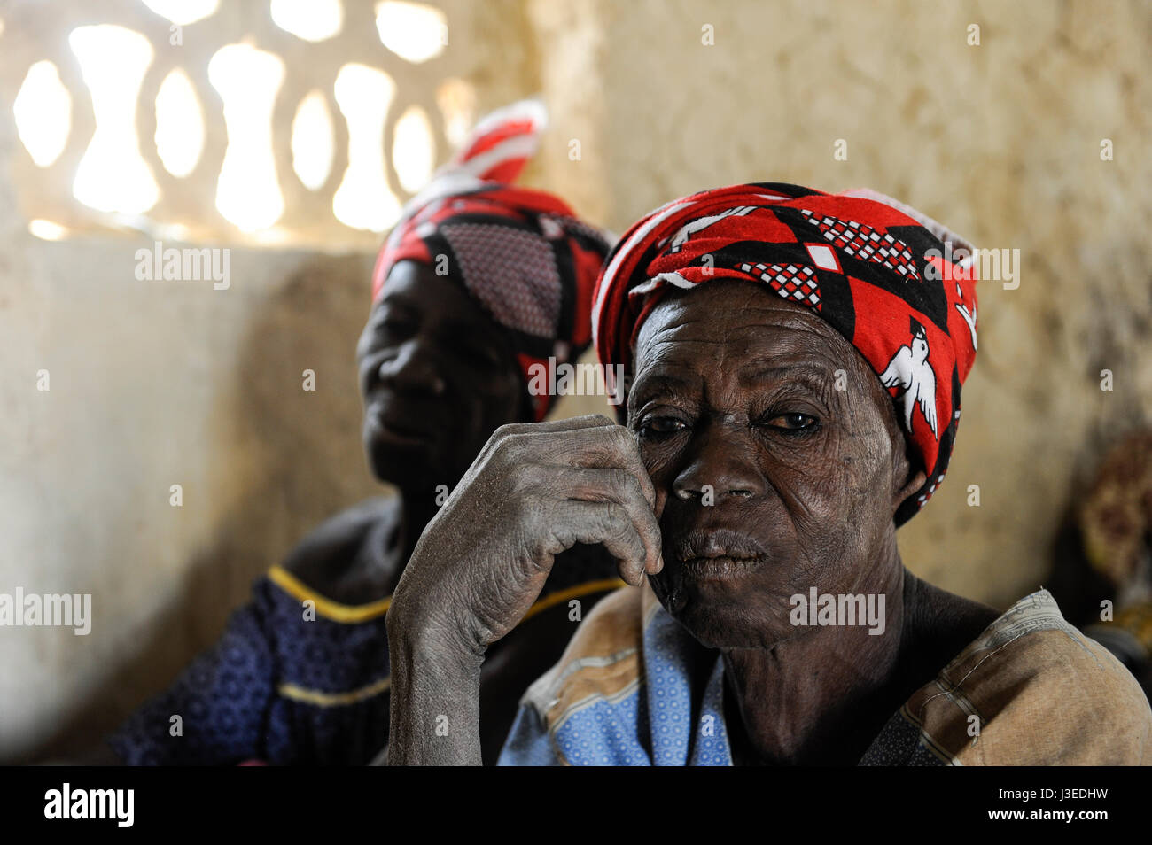 BURKINA FASO, Korsimoro, old women with red headgear in small church in village Samboaga Stock Photo
