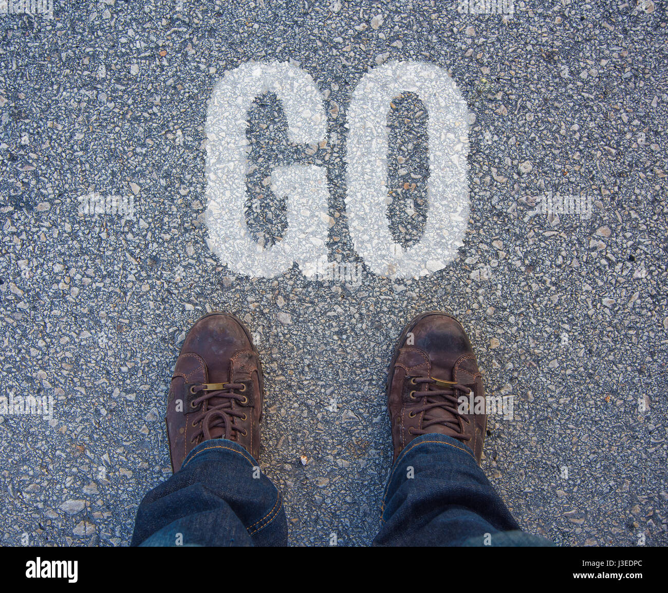 Feet on the street with text Let's Go Stock Photo