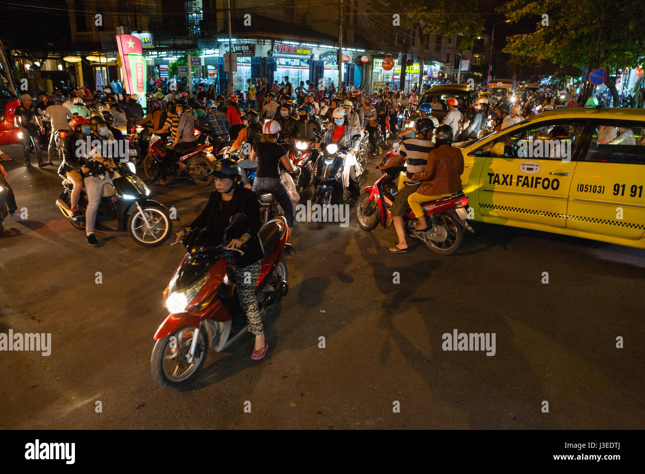 Hoi An, Vietnam - march 11 2017: totally jammed crossroad. People came to the city to celebrate Full Moon Festival on huge numbers of scooters, which  Stock Photo