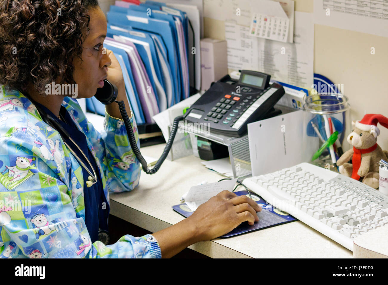 Miami Beach Florida,Mt. Mount Sinai Medical Center centre,hospital healthcare office phone phones,medical assistant Black African Africans,woman femal Stock Photo