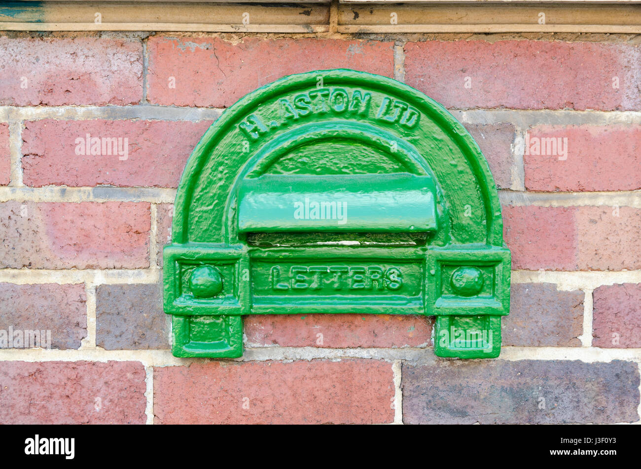 Small old fashioned wall mounted letter box in the Jewellery Quarter in