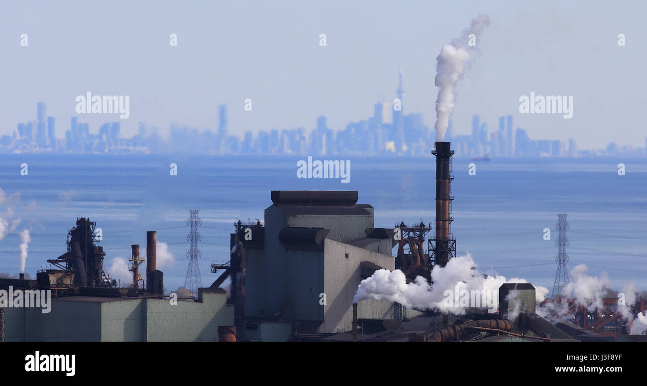 Hamilton industrial area with Toronto skyline behind Stock Photo Alamy