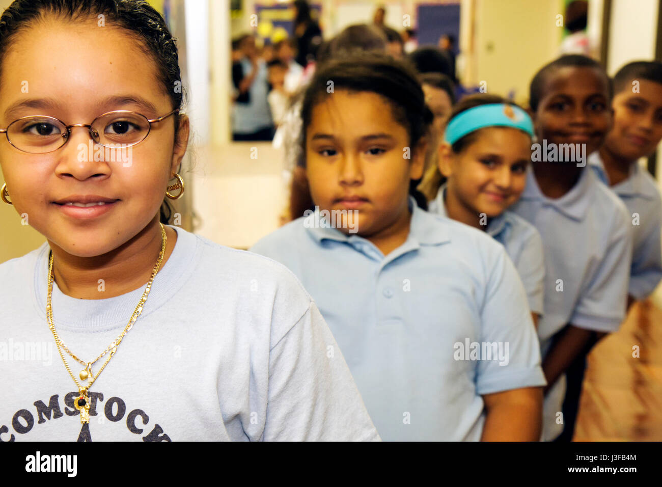 Miami Florida,Comstock Elementary School,Welcome Back,Backpack Giveaway,Hispanic girl girls,female kid kids child children youngster,boy boys,child,ch Stock Photo