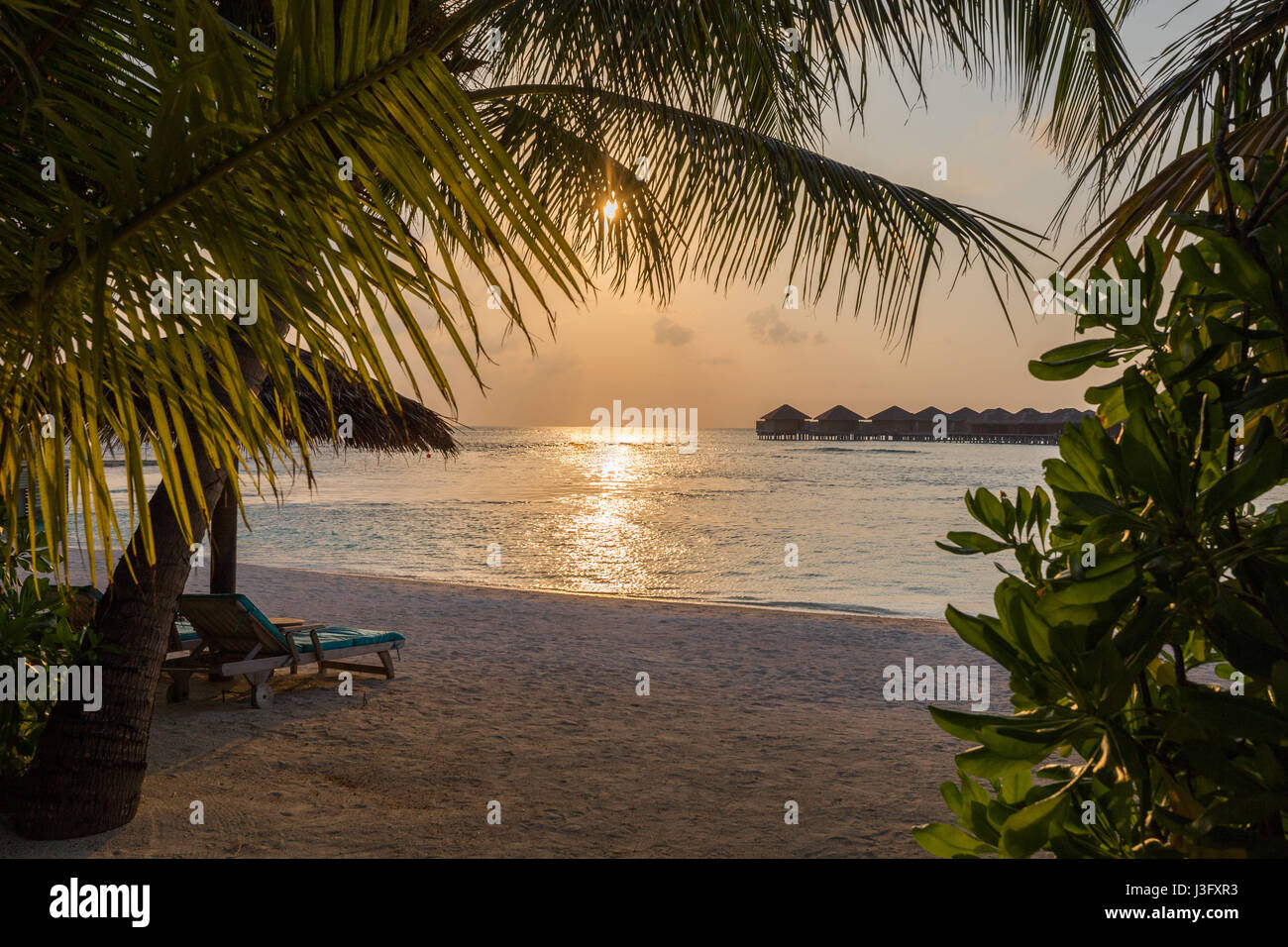 Tropical Paradise Sunset Sunrise View of Over Water Bungalows with