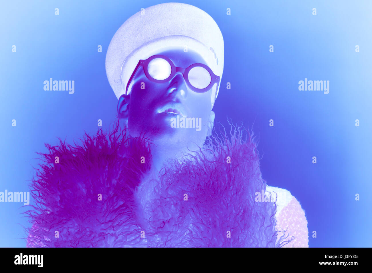 one young adult man, theatrical gay homosexual portrait, fur, negative Stock Photo