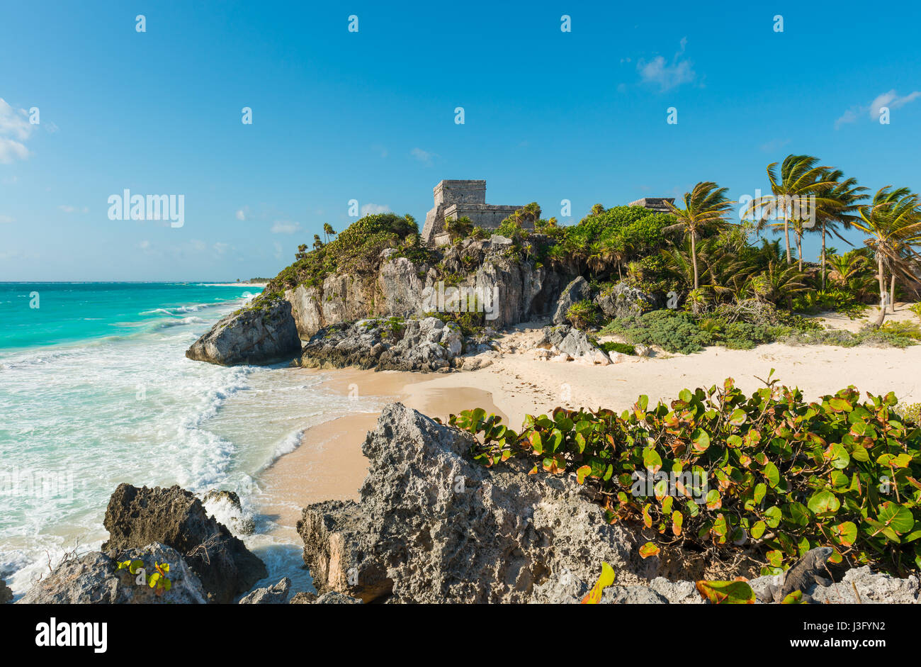 The Mayan ruins of Tulum with the God of winds temple by the white sand beach of the Caribbean Sea in the state of Quintana Too, Mexico. Stock Photo