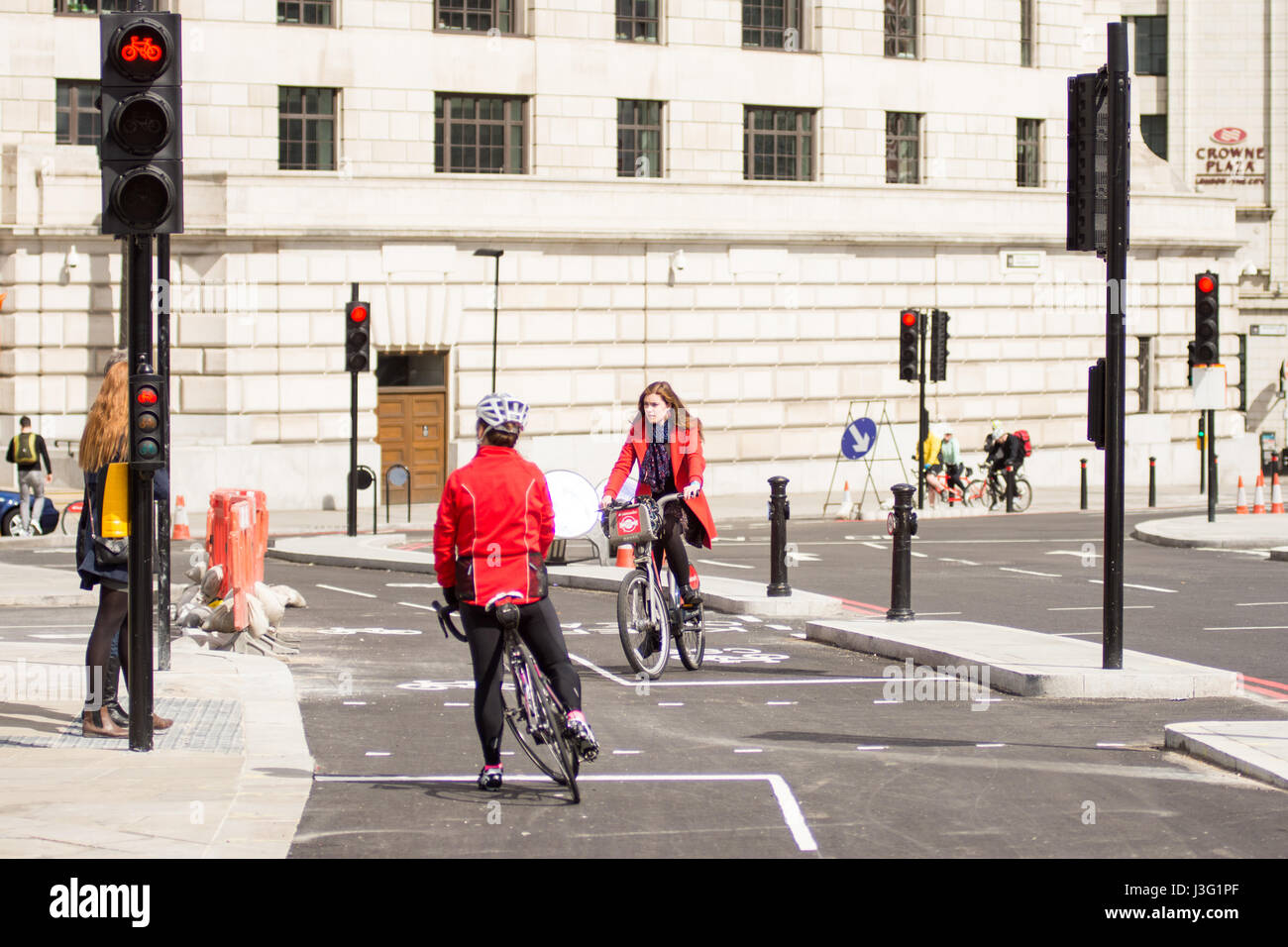 London, England - April 30, 2016: Cyclists using the newly completed segregated North-south Cycle Superhighway, CS6, at Blackfriars Bridge. Stock Photo