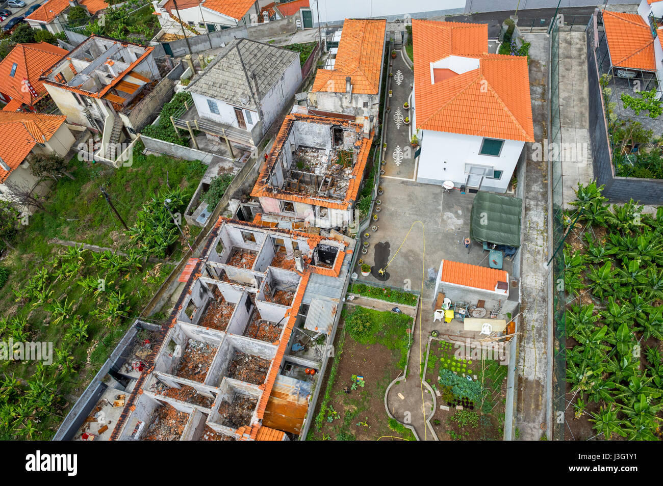 Fire damaged homes in Funchal, Madeira after a wildfire raged through the island Stock Photo
