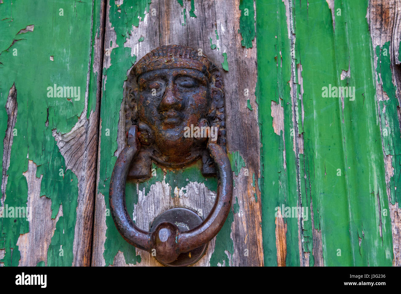 Egyptian Pharaoh door knocker on a wooden door. Stock Photo