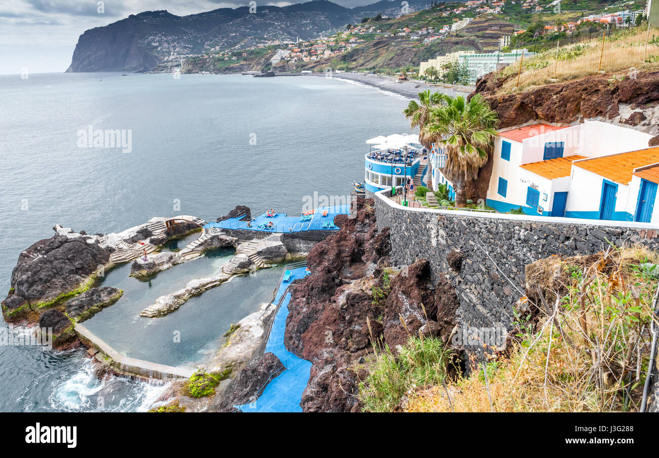 Open air lido carved into the rocks and beach, Funchal, Madeira Stock ...