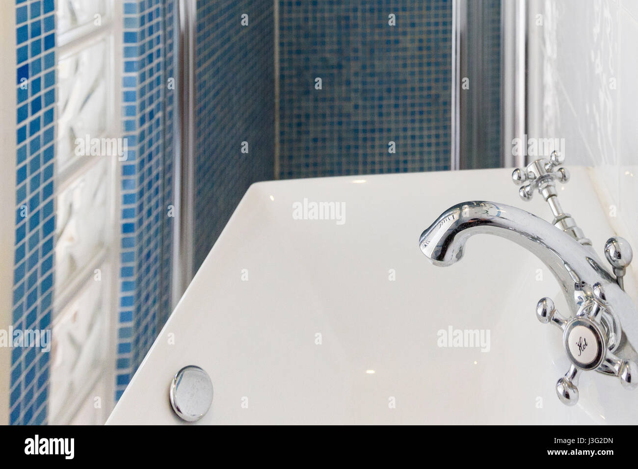 Modern soap dispenser in ensuite shower room Stock Photo