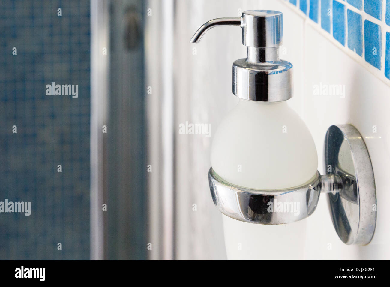 Modern soap dispenser in ensuite shower room Stock Photo