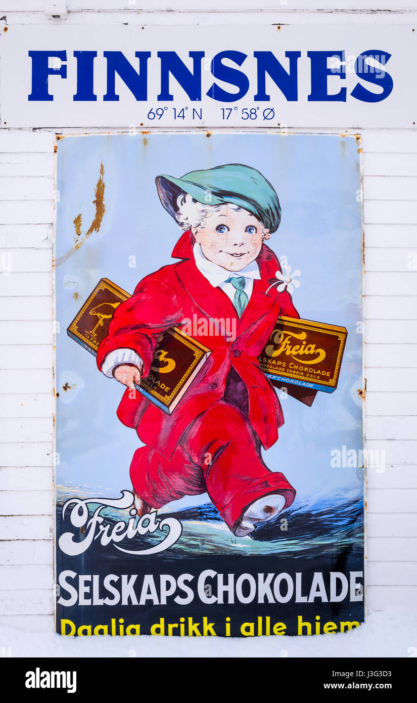 Vintage signboard advertising  chocolate at the port of Finnsnes, Troms County, Norway. Stock Photo