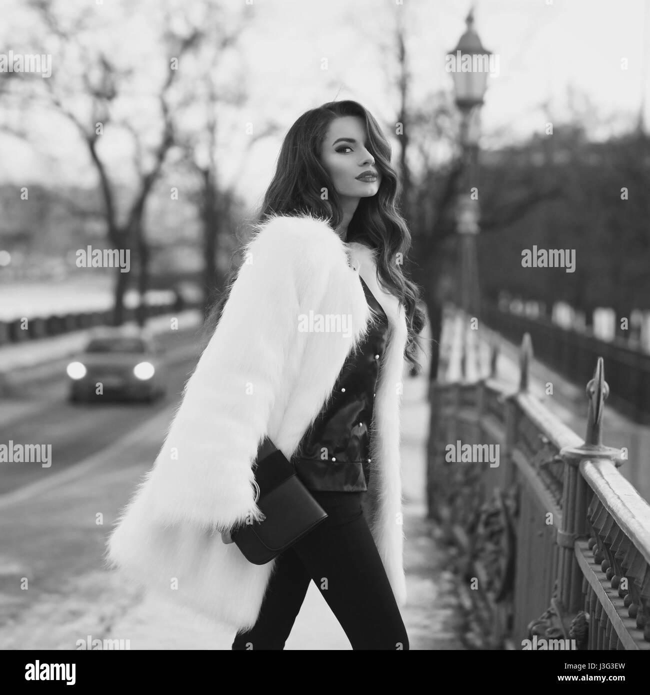 Fashionable woman in fur coat Black and White Stock Photos & Images - Alamy