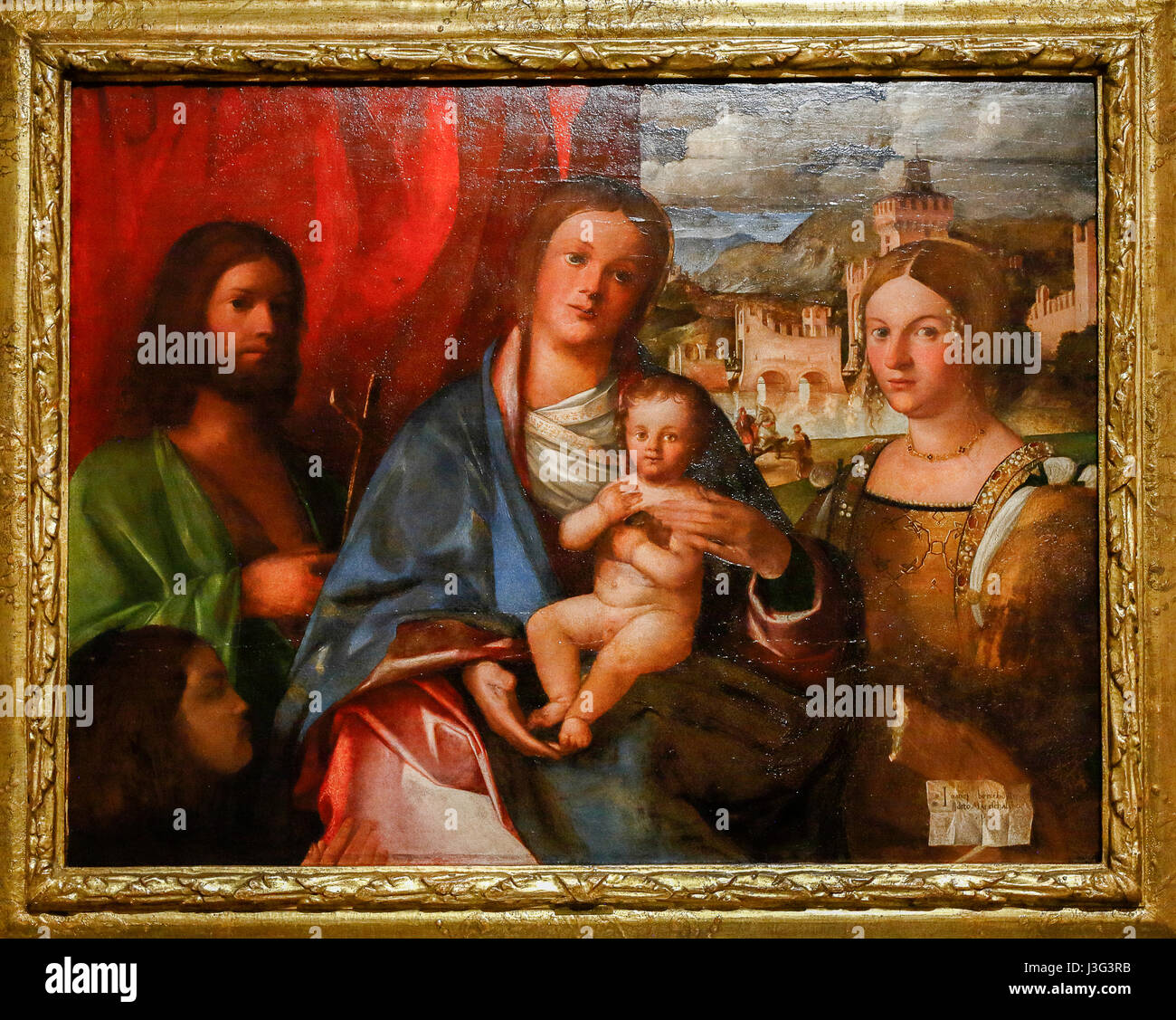 Pesaro: Secret Renaissance Show: Giovanni Bonconsiglio: Madonna and Child Among the Saints John Baptist, Catherine and the Buyer Stock Photo