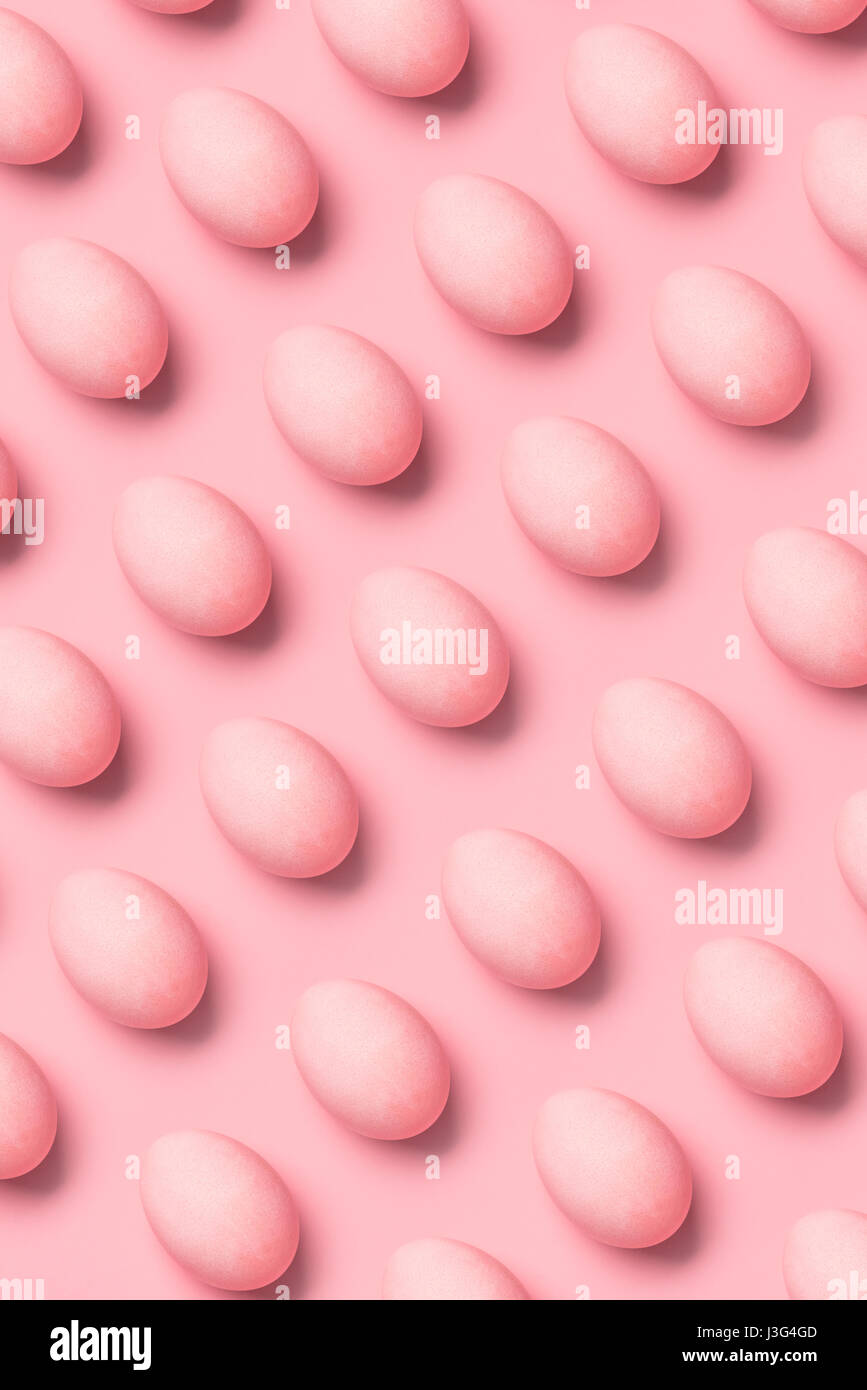 top view of rows of painted pink eggs for easter. Happy Easter concept Stock Photo