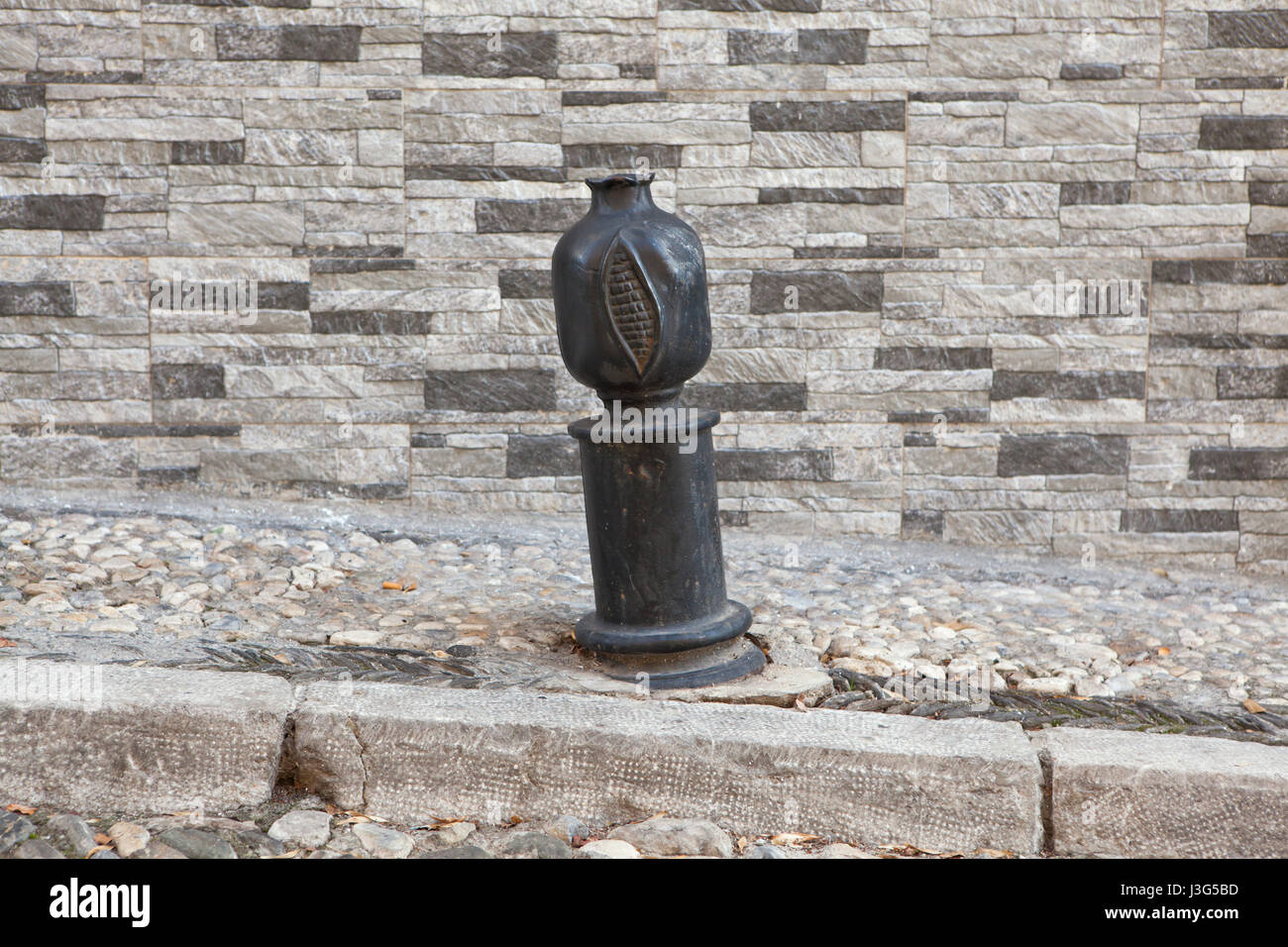 Street bollard in the shape of pomegranate in El Albayzin district in Granada, Andalusia, Spain. Stock Photo