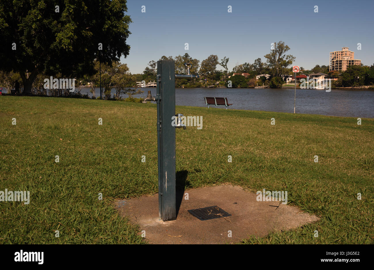 Brisbane, Australia: Water tap and standpipe on post in park Stock Photo