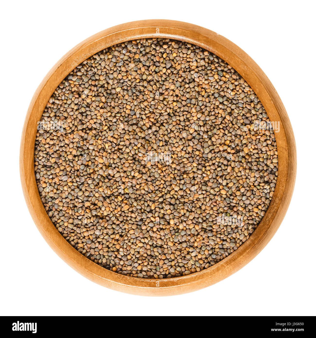 Wild rocket seeds in wooden bowl. Diplotaxis tenuifolia, also perennial wall rocket, Lincoln weed or wild Italian arugula. Used for sprouting. Stock Photo