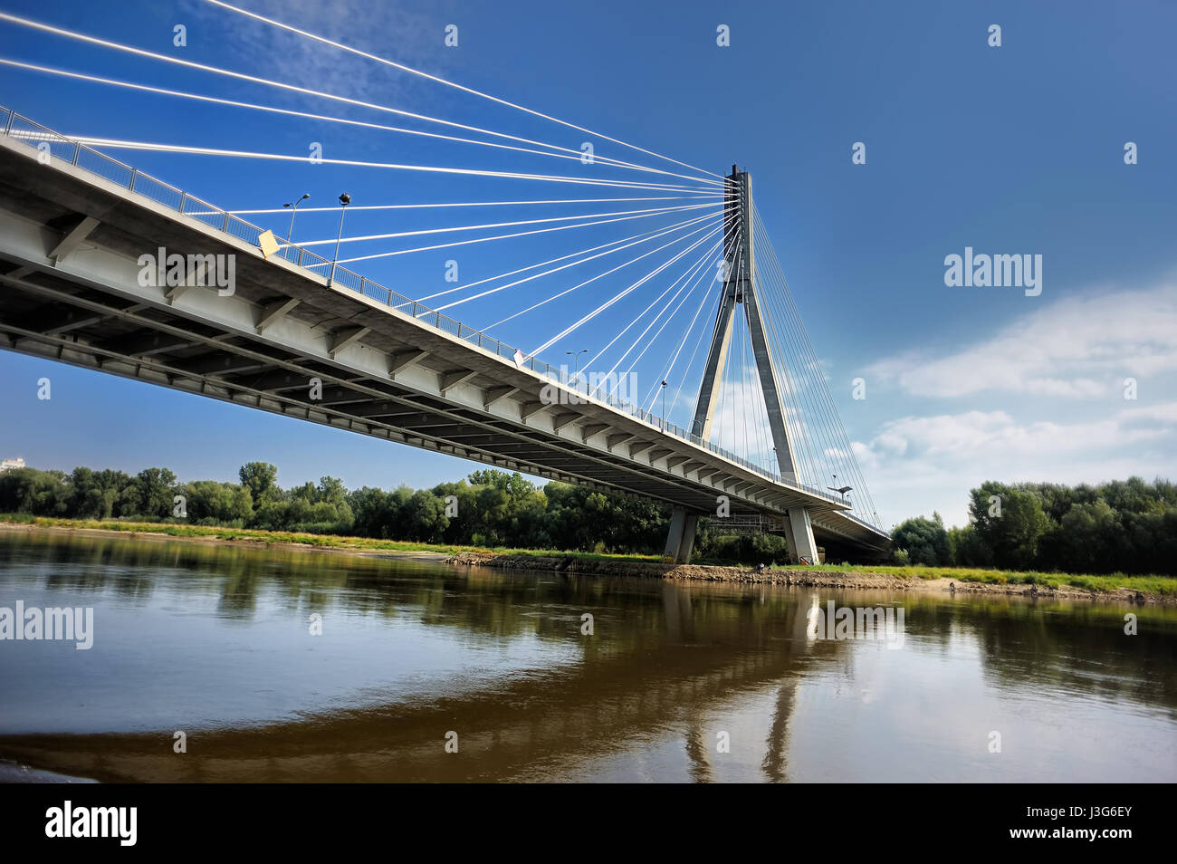 Modern Swietokrzyski bridge in Warsaw over Vistula river, Poland Stock Photo