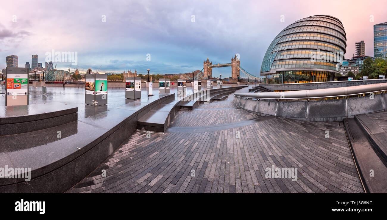 LONDON, UNITED KINGDOM - OCTOBER 7, 2014: London City Hall and Tower Bridge in London, UK. The City Hall has an unusual, bulbous shape, was designed b Stock Photo