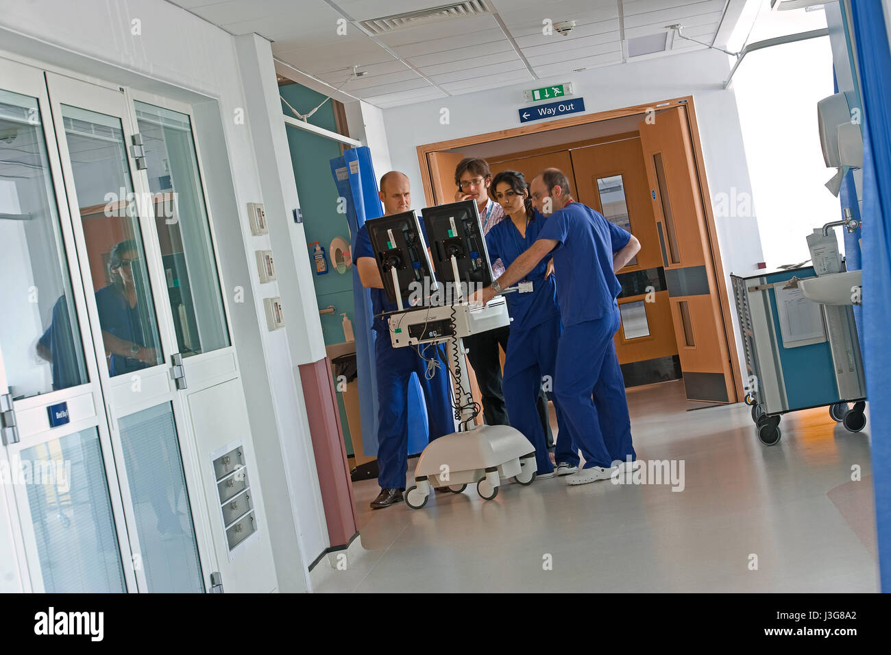 Surgical staff in hospital diagnosing from scans Stock Photo